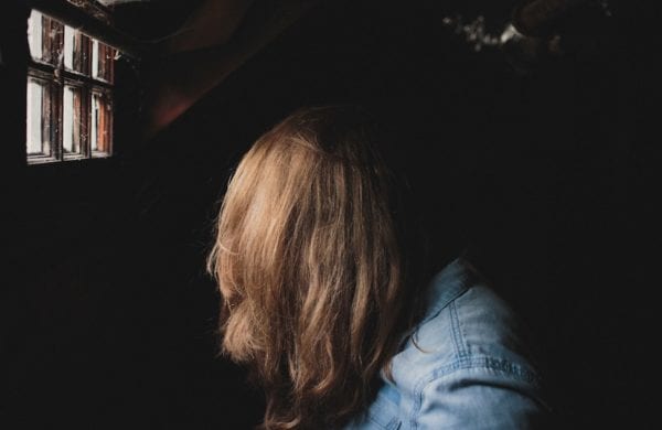 woman's face obscured by her hair