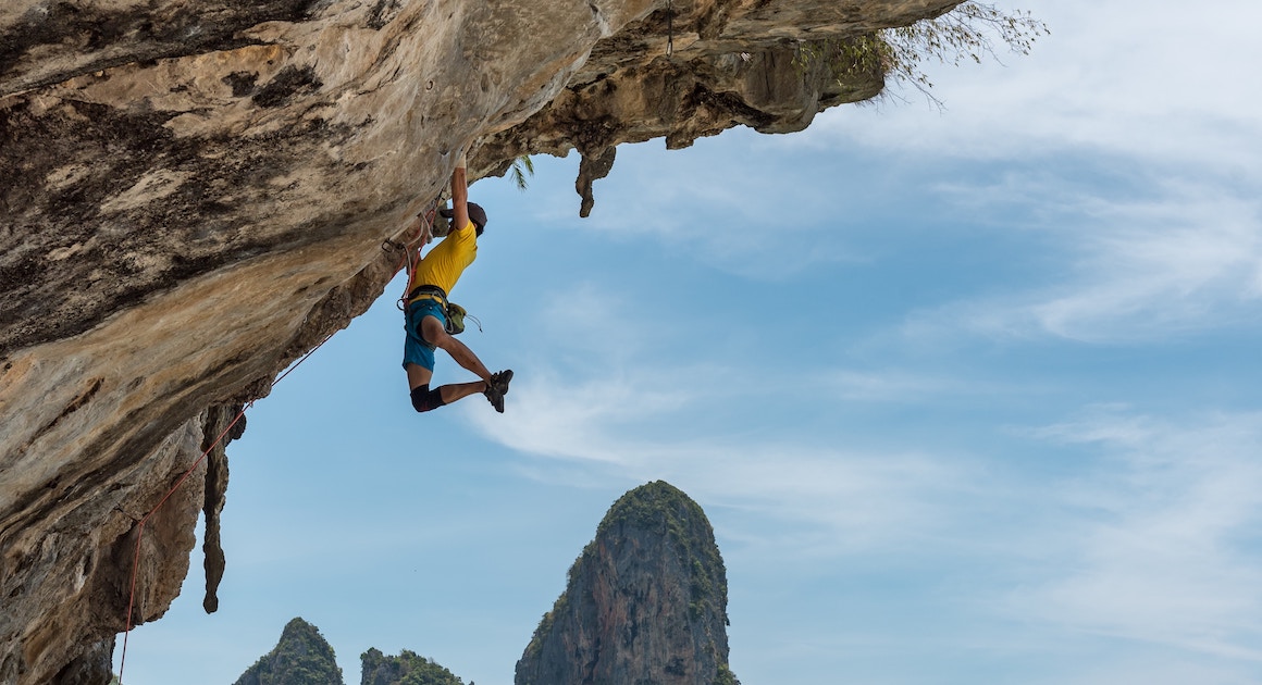 Man hanging from a cliff