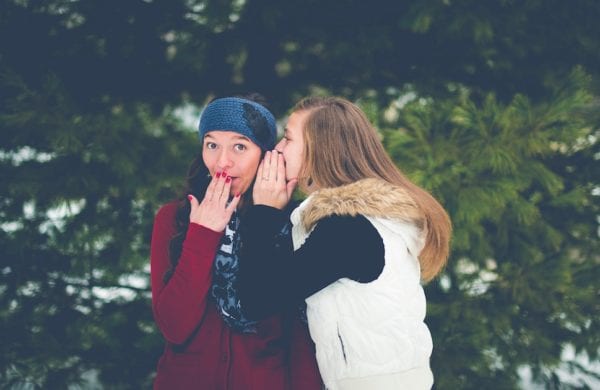 two women gossiping in winter