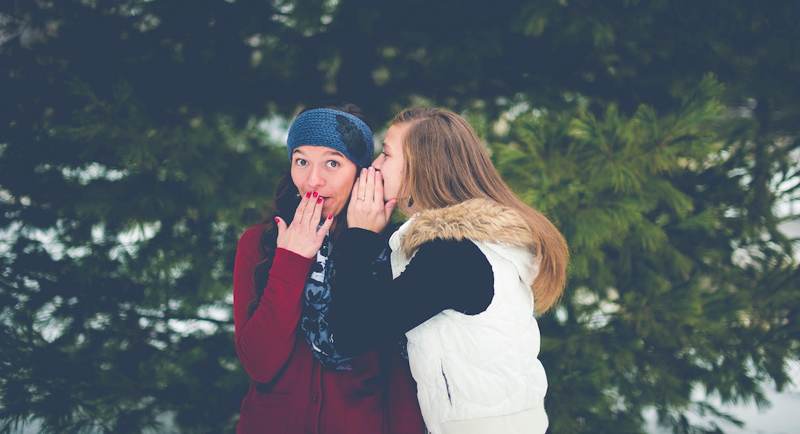 two women gossiping in winter