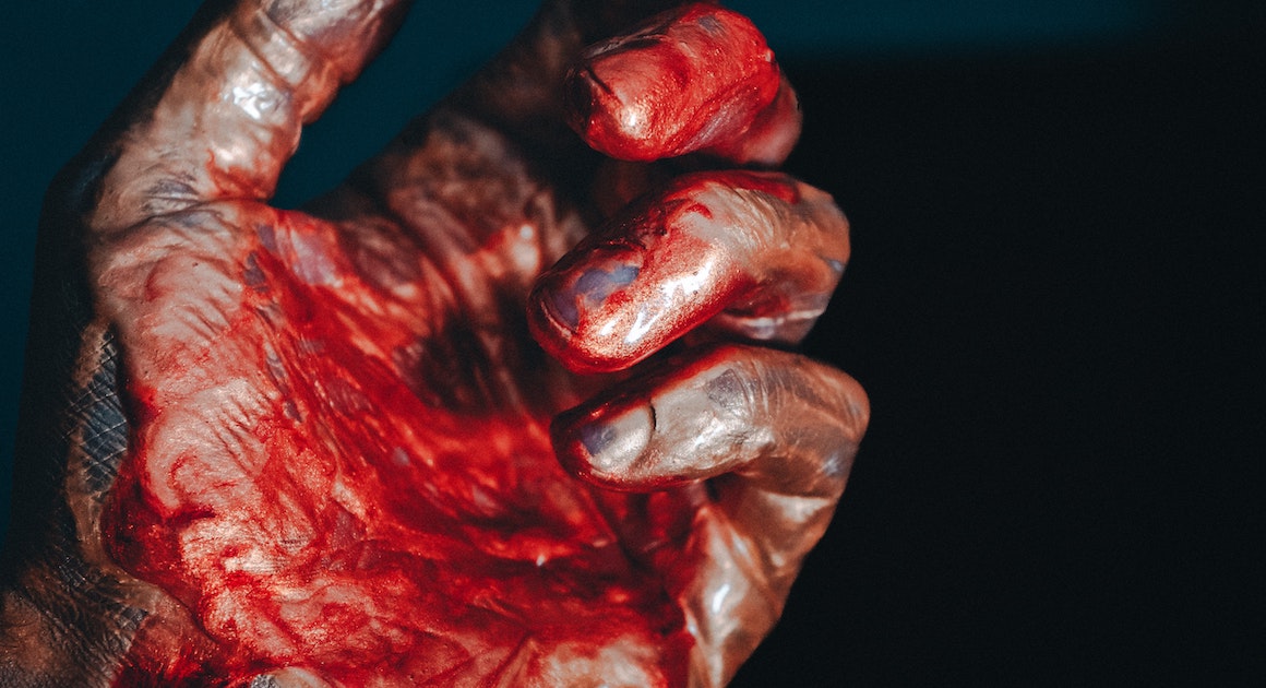 a hand with blood on it