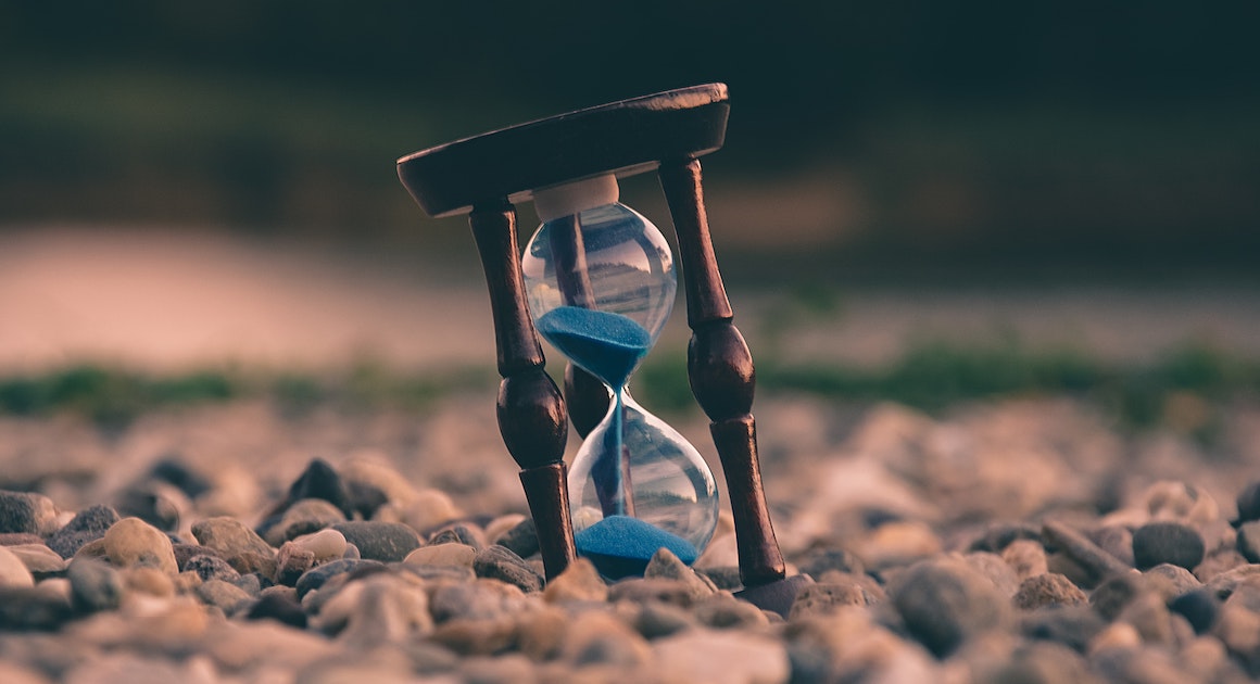 an hour glass on a beach