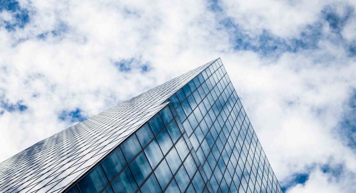 a building edge against a cloudy sky