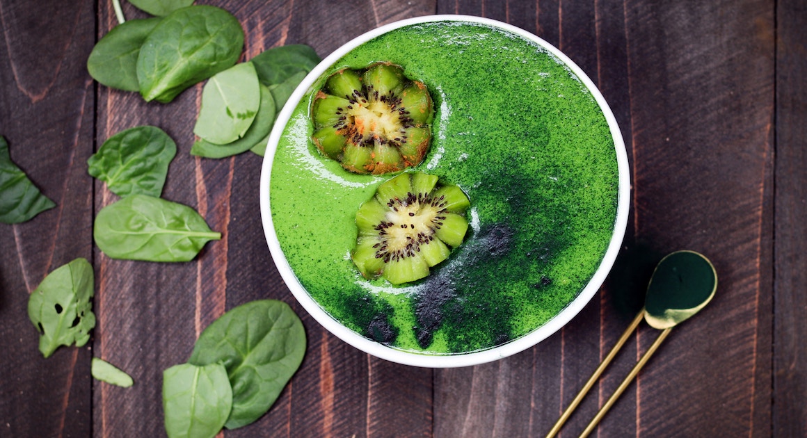 a bowl of spirulina on a table