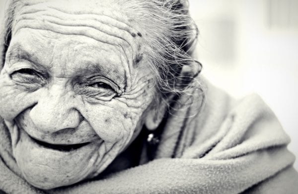old woman smiling with wrinkles