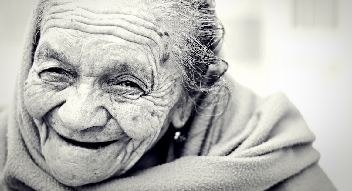 old woman smiling with wrinkles