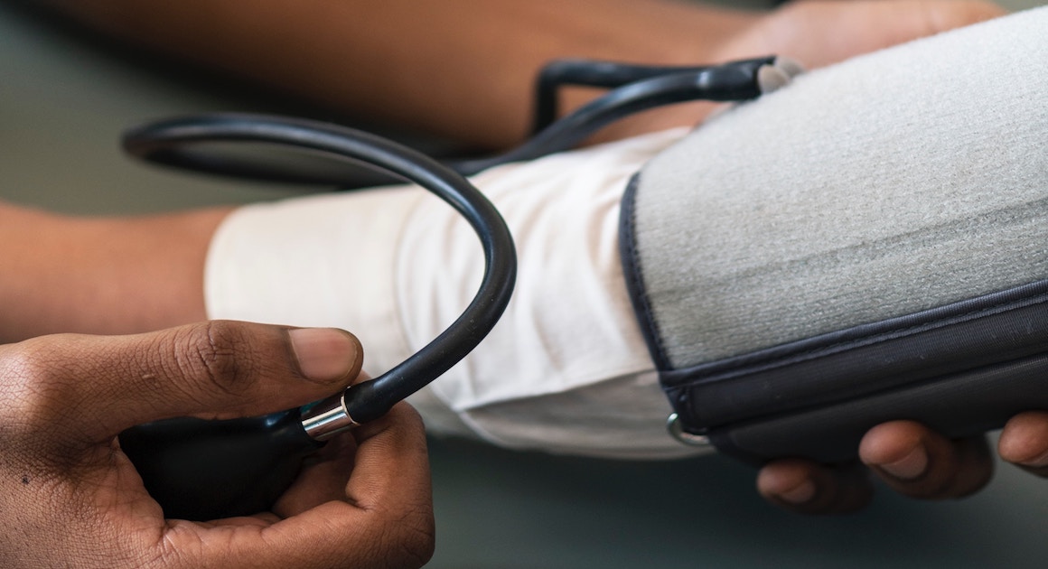 direct primary care doctor checking a blood pressure