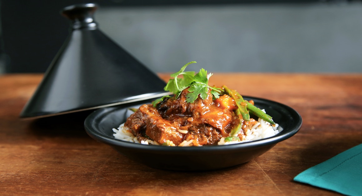 a bowl of curry on a table