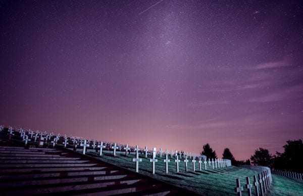 rows of graves beneath a night sky