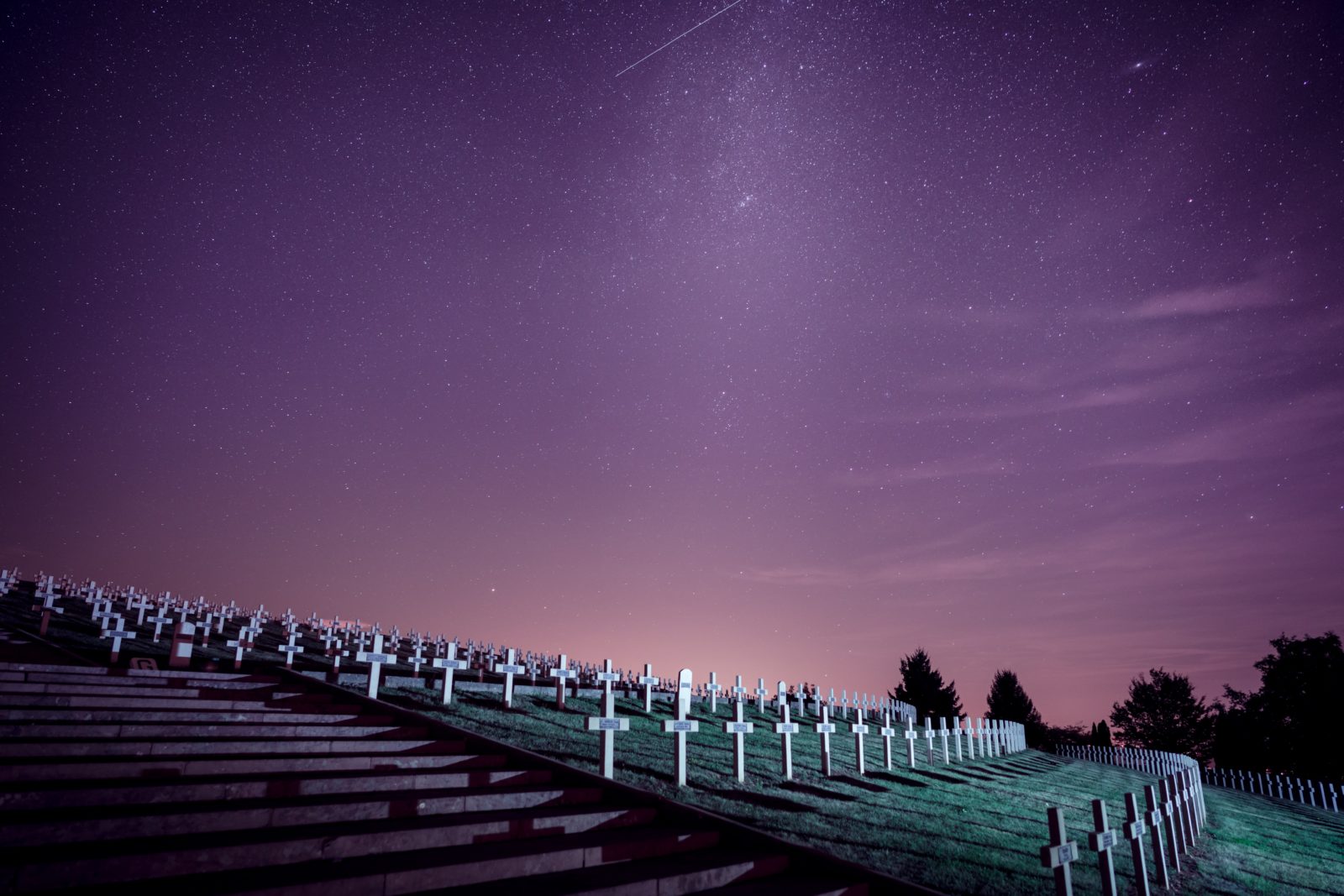 rows of graves beneath a night sky