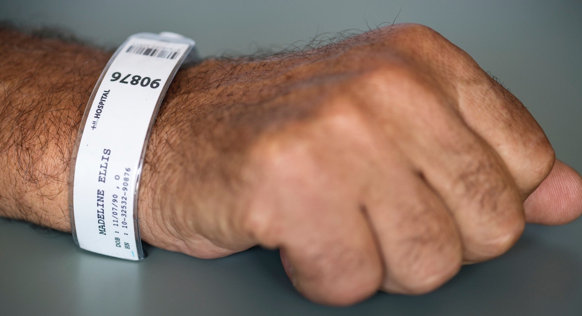 a wrist band around a hospital patient