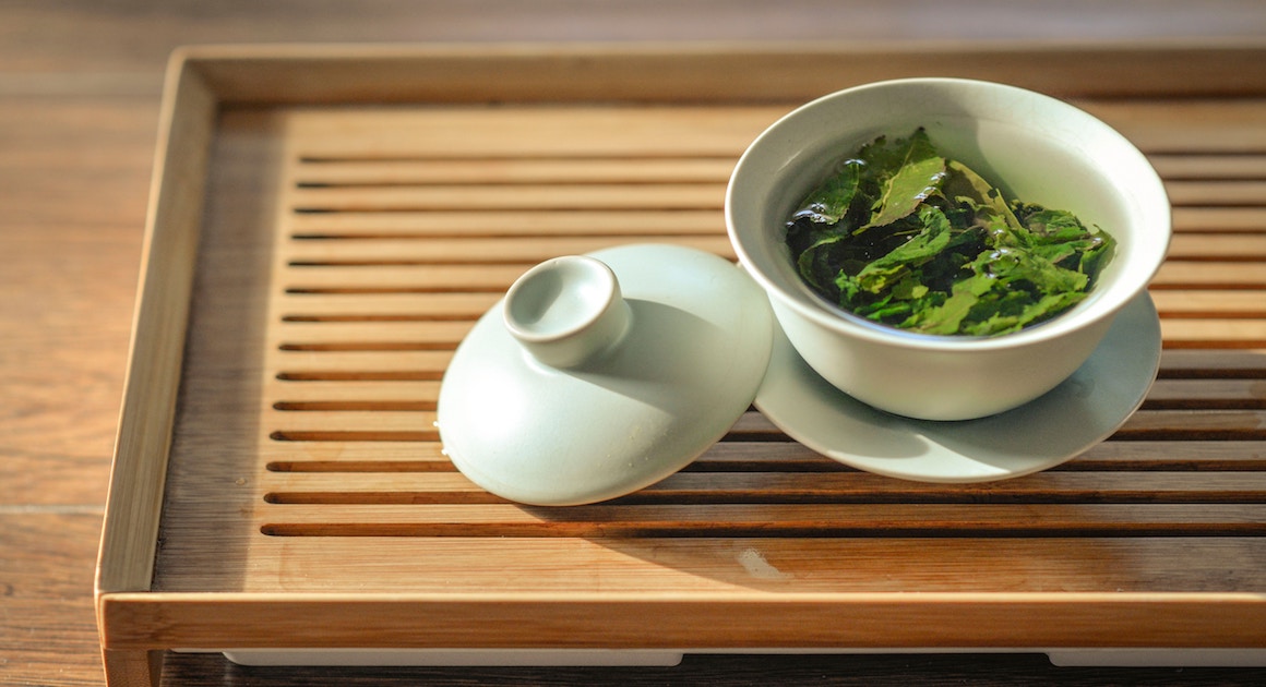 a cup of tea on a wooden table