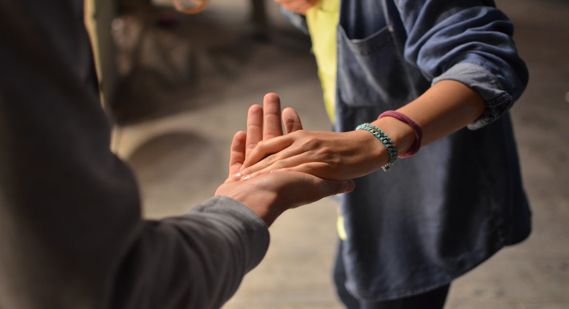 two people holding hands