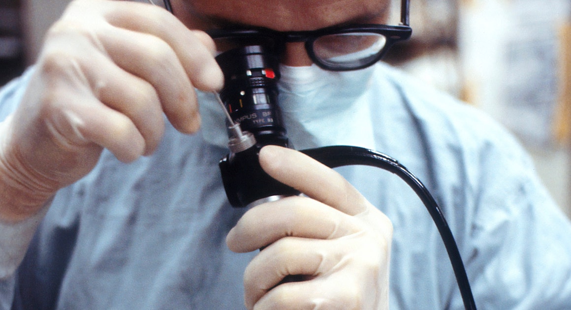 a doctor scopes a patient